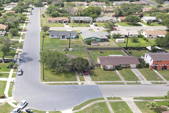 Aerial image of neighborhood with their roads maintained with GAF roads asphalt pavement preservation