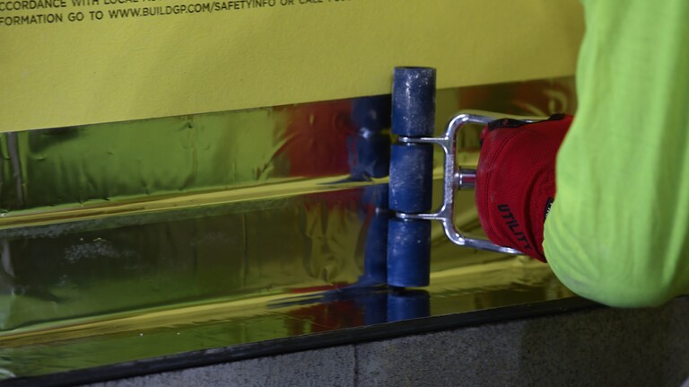 WALLcontrol™ polyiso foil-faced insulation on a commercial building exterior.